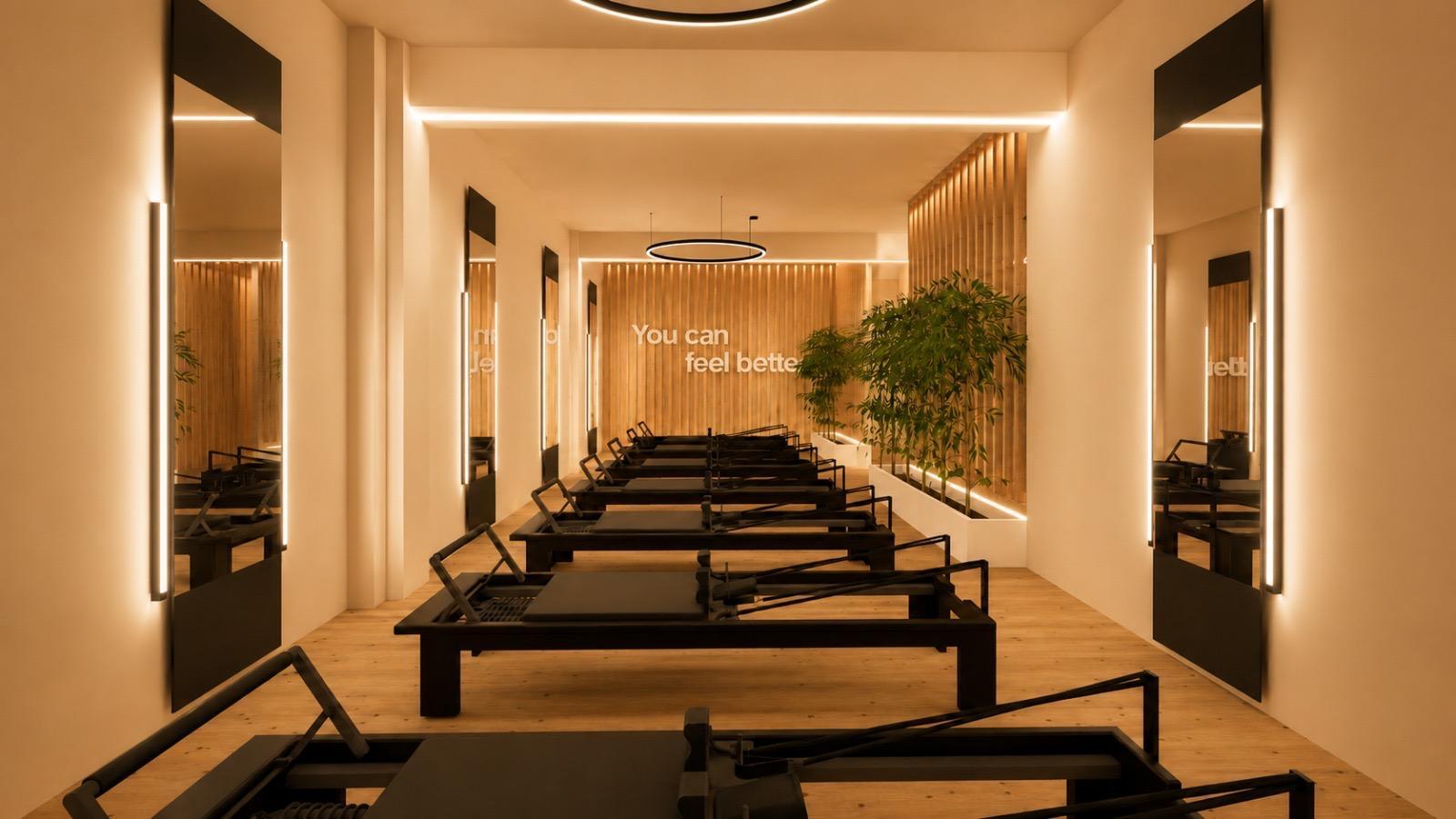 Imagem 3D da sala de Reformer com espelhos do BLIVE Pilates Alvalade